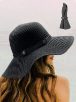 Chapeau capeline en paille souple noire porté par une femme