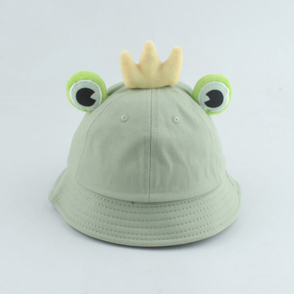 Bob vert pâle avec des yeux de grenouille et une petite couronne jaune entre les deux yeux.